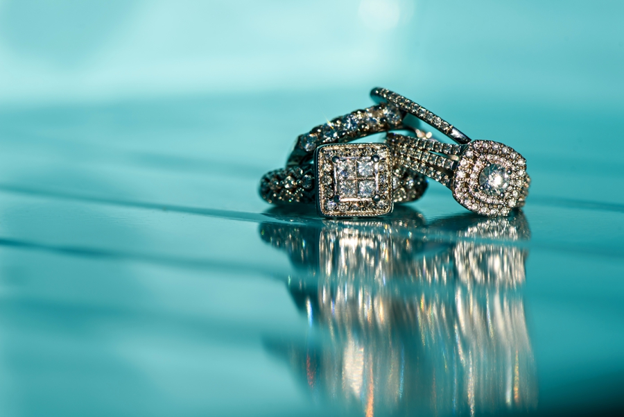 LGBTQ wedding rings on a blue boat.